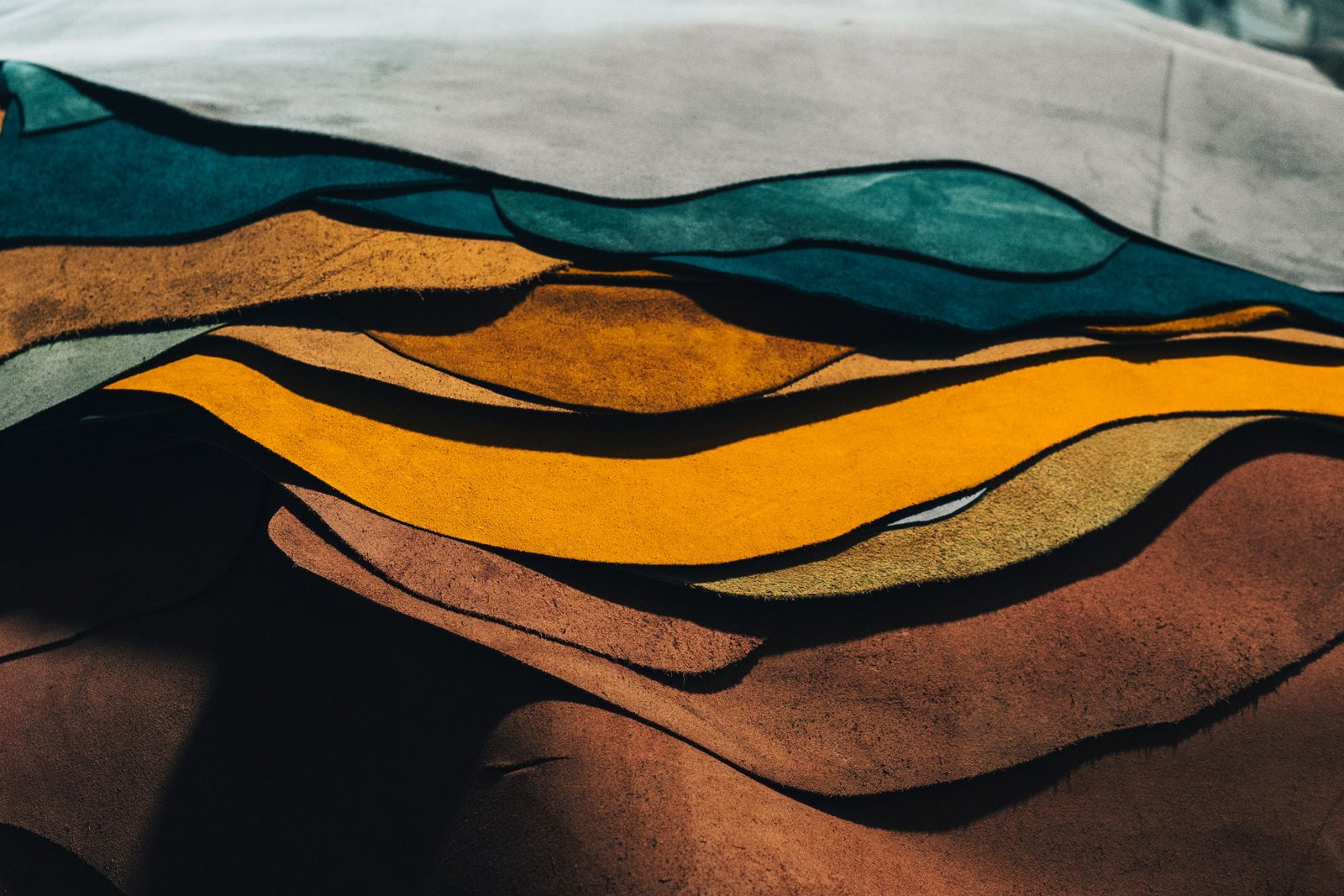 Artistic abstract painting featuring wavy lines and vibrant colors, evoking a sense of dynamic movement.
